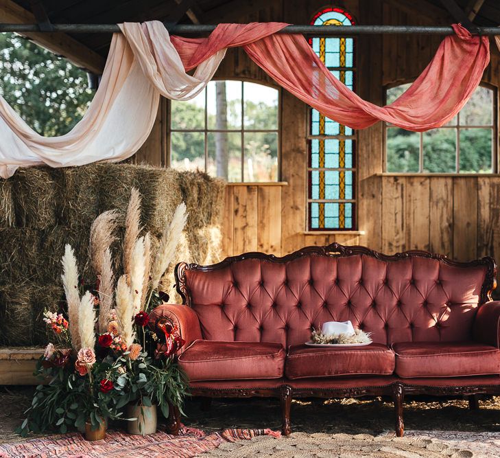 Chic pink sofa with draped fabrics 