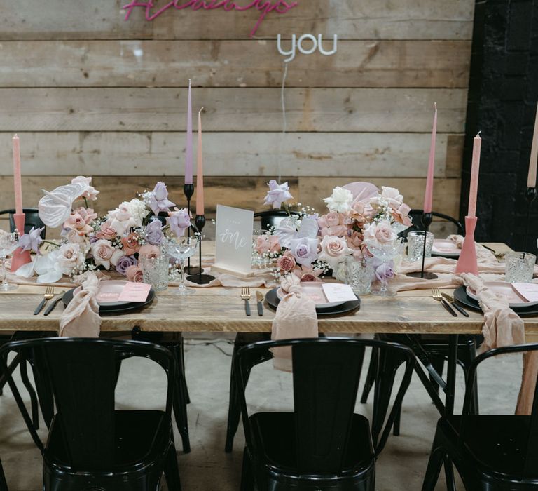 pink and purple wedding decor ideas with pastel flowers and taper candles 