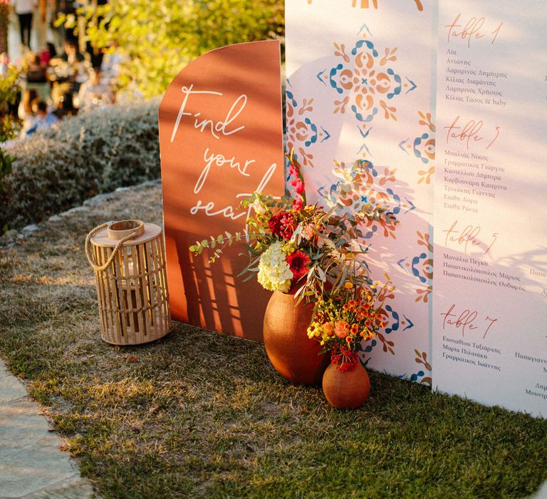 A modern table seating plan with terracotta colour palette and tile detailing