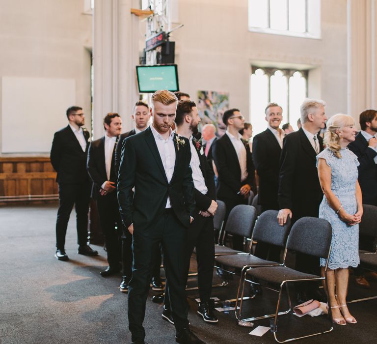 Groom waits for bride in the church