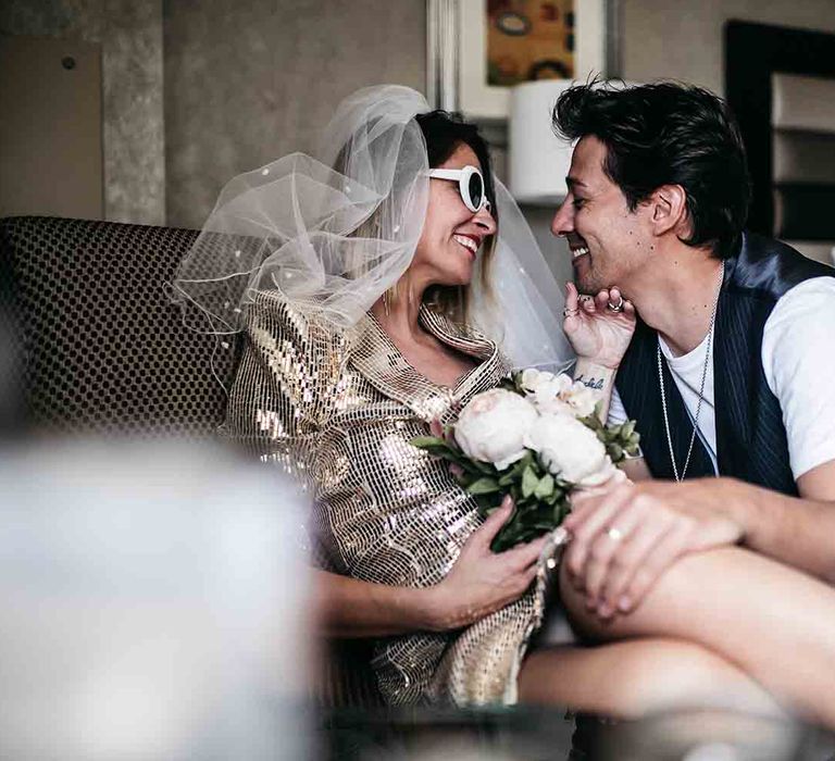 Bride in gold wedding dress with groom at Las Vegas wedding