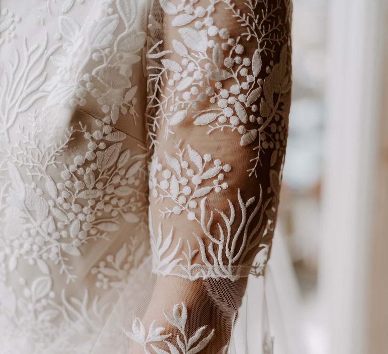 Lace floral embellishment detail on wedding gown