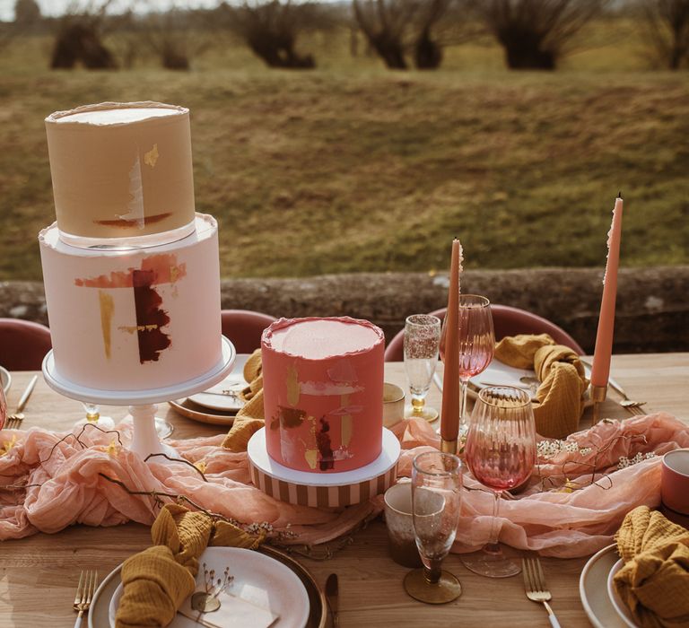 Contemporary wedding cakes on blush tablescape