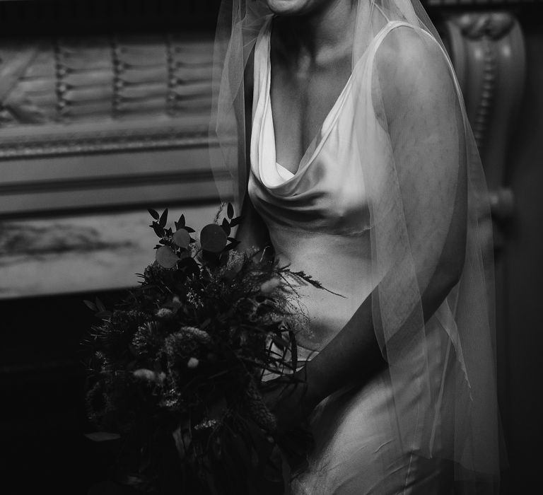 Bride in a satin Ghost wedding dress with cowl front and a Juliet wedding veil 