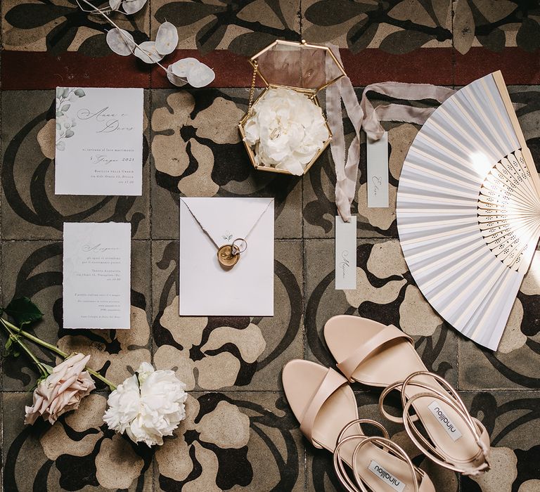 Contemporary stationery in white complete with neutral colour wedding shoes