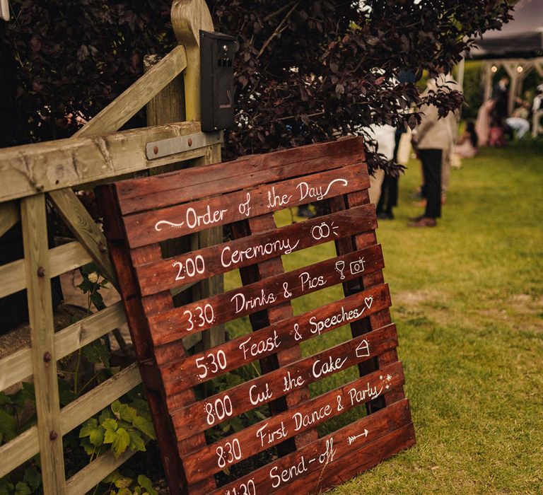 DIY order of service on wooden pallet 