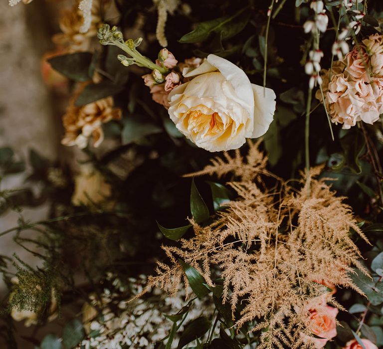 Blush peach and pink wedding flowers including roses and astilbe