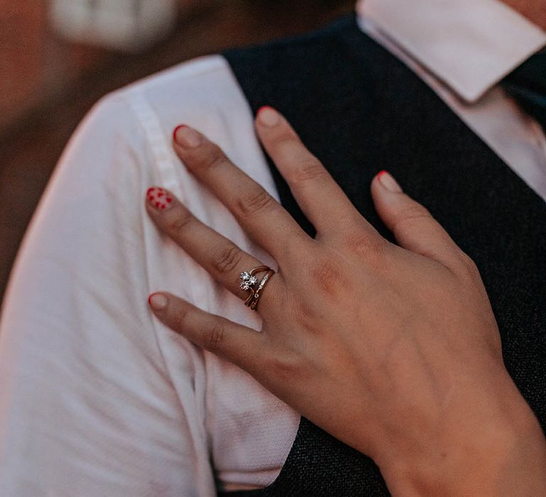 red tip wedding day nails and diamond engagement ring 