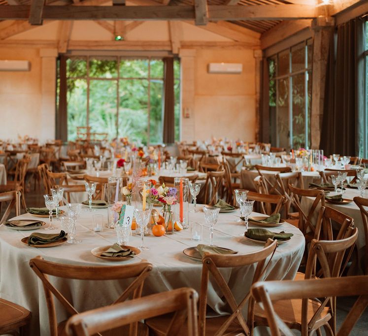 Wedding reception at Domaine de Blanche Fleur with citrus fruit decor and taper candles 