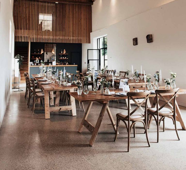 Reception room of Brickhouse Vineyard Devon wedding venue with modern rustic wedding tablescape 