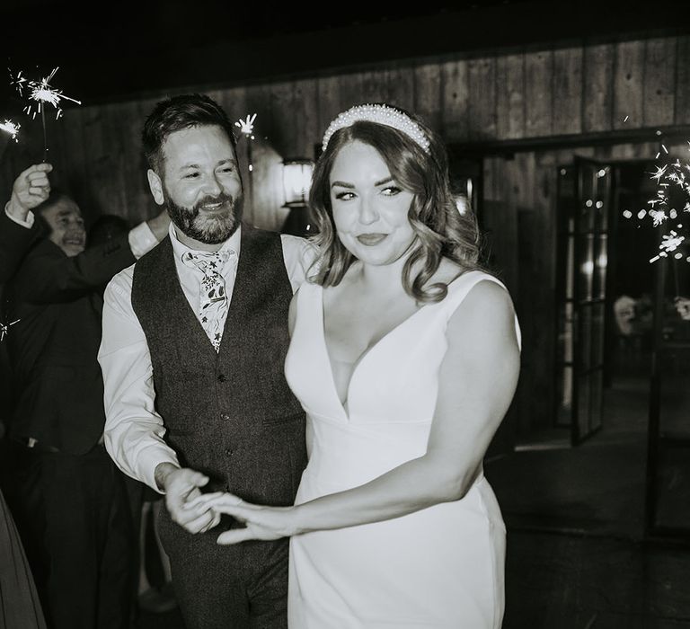 The bride and groom have a classic sparkler send off 