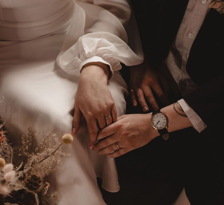 Bride wearing flats white trainers for the wedding day in white wedding dress 