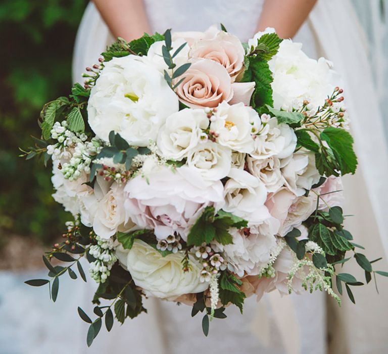 Traditional pink and white rose and peony wedding bouquet