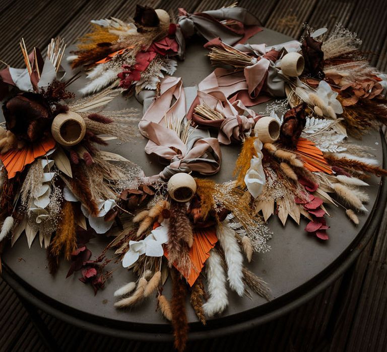 Boho autumnal wedding bouquets with pampas grass and bunny grass tied with ribbon