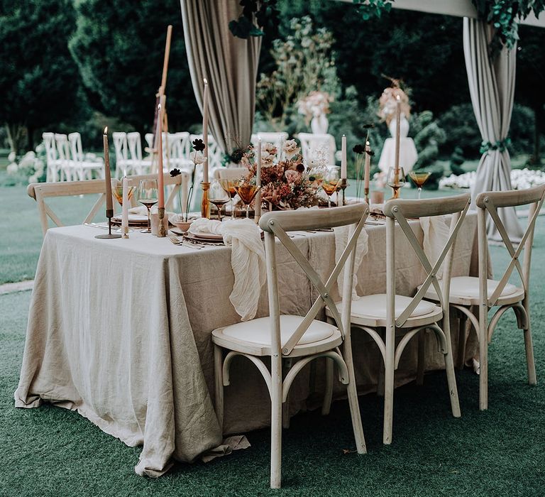 Marquee at garden wedding at The Holford Estate with neutral tablescape 