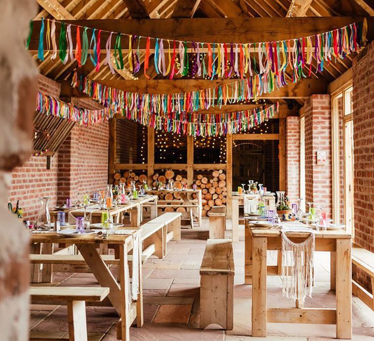 DIY colourful bunting at barn wedding 