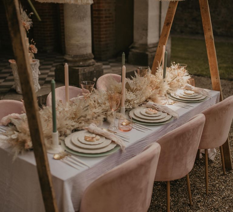 wedding table decor with blush and neutral decor and flowers 