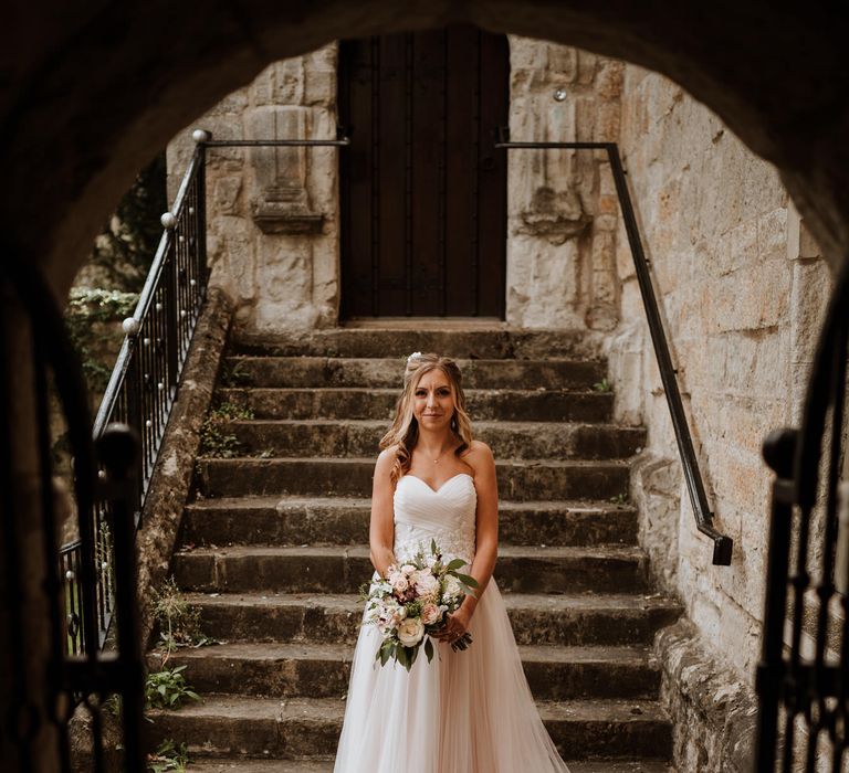 Beautiful bride in strapless Wed2b wedding dress in blush tulle