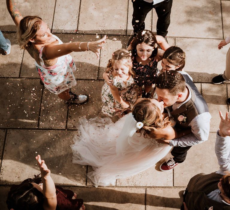 Outdoor first dance with confetti being thrown over the couple 