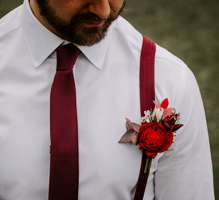 Groom with red rose in lapel