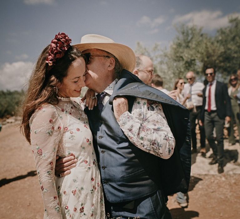 The Bride and her father both wear florals