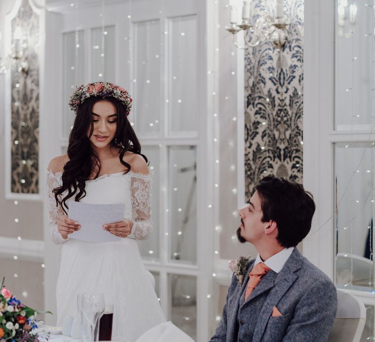 Bride reads wedding vows in Asos Bridal dress