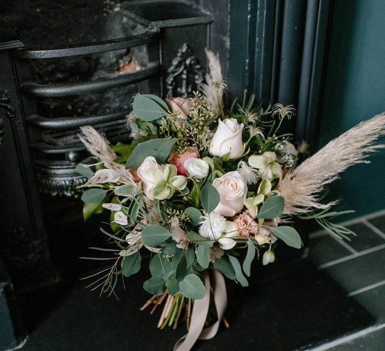 Pink roses and eucalyptus wedding day bouquet 