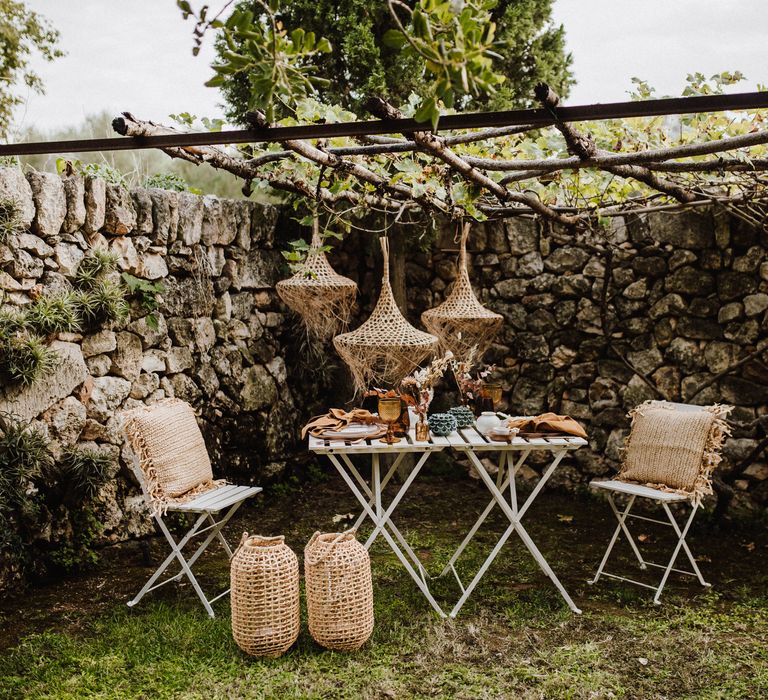 Wicker woven lampshades above white table 