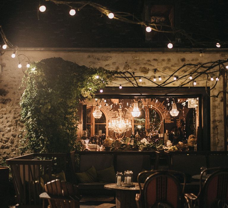 Chill out area with comfy seating, and chandelier decor 