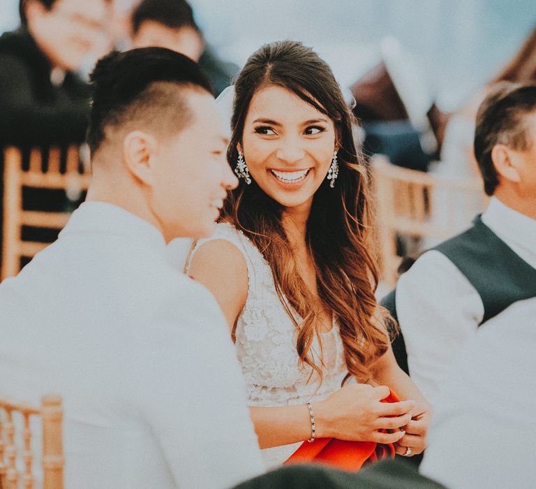 Bride laughs during wedding reception