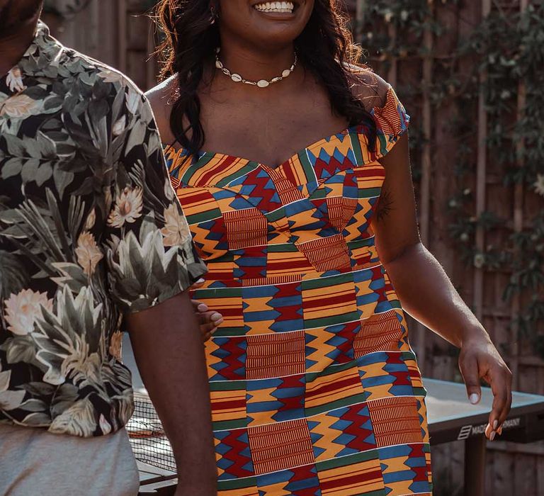 Bride laughs on her wedding day in traditional Ghanaian outfit