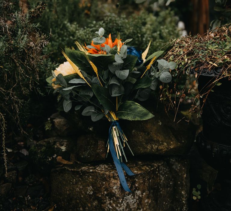 Green, orange and blue tropical wedding bouquet for farm wedding in Lancashire