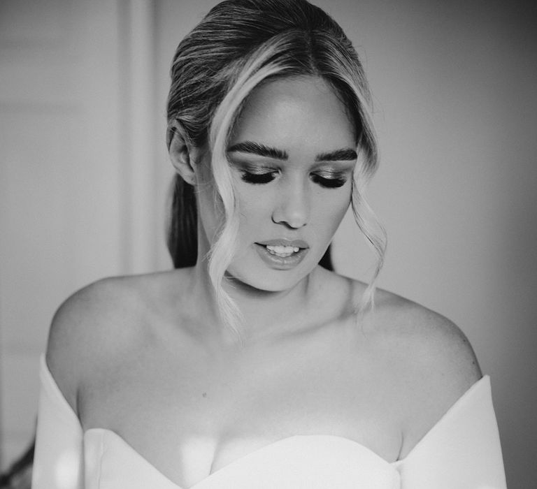 Beautiful bride in a strapless sweetheart neckline wedding dress with detachable long sleeves 