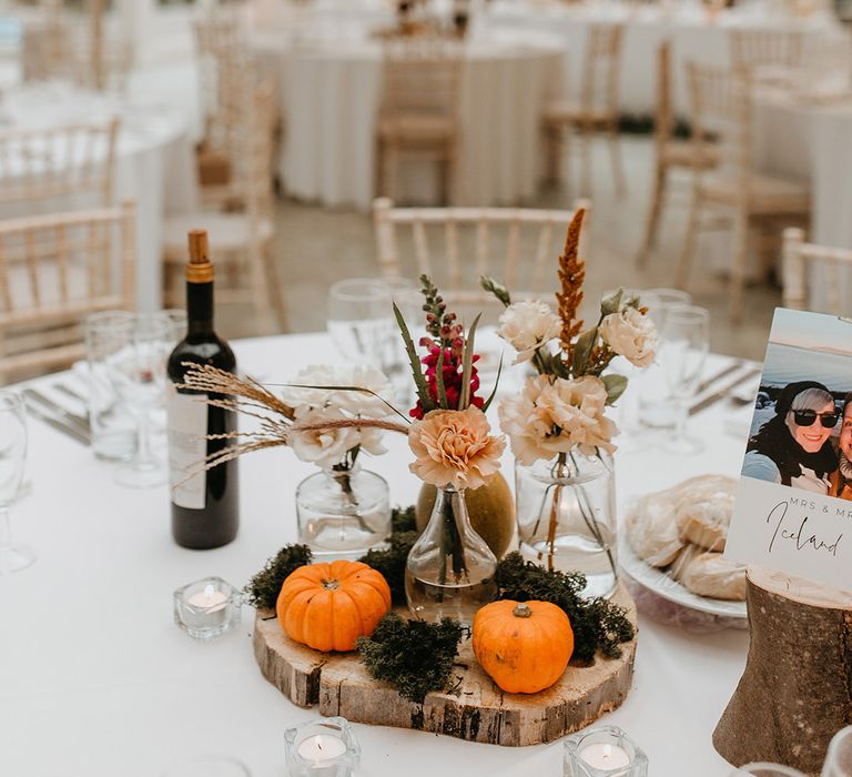 Pumpkin wedding decoration on wooden block for Autumnal tablescape