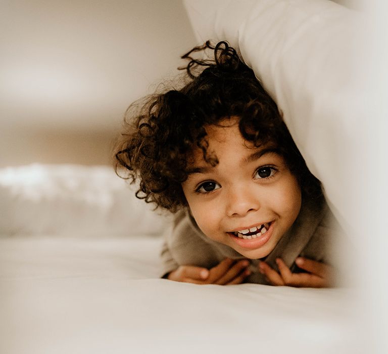 cute page boy with naturally curly hair 