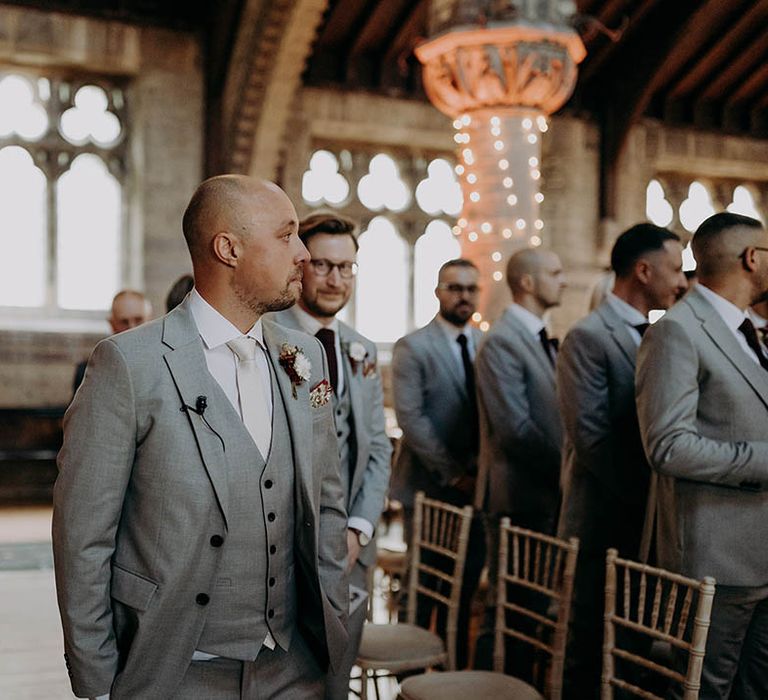 Groom watches as his bride walks down the aisle on their wedding day | Irene Yap Photography