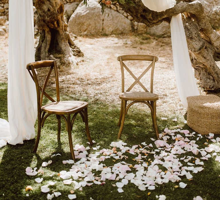 Wooden chairs waiting for the bride and groom 