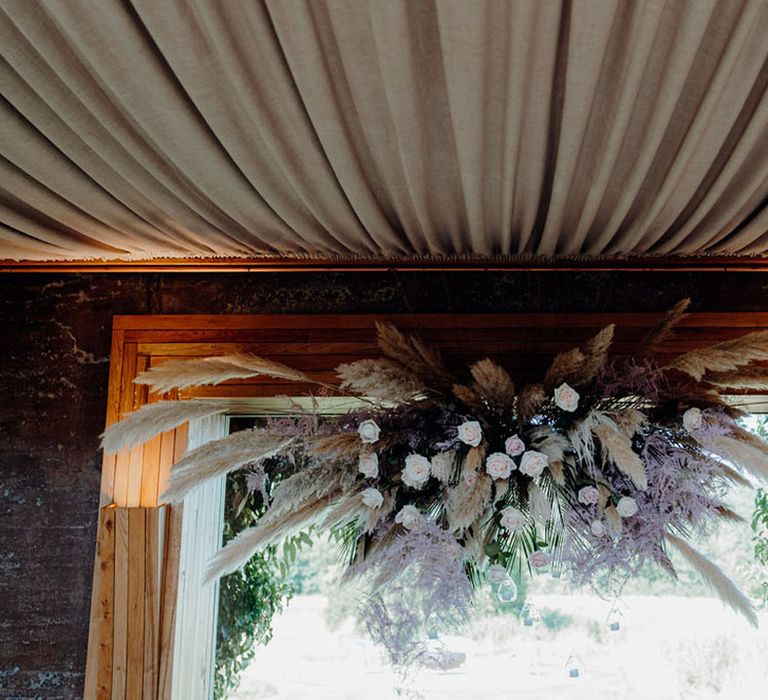 Large pink and neutral coloured pampas cloud designed by Corky & Prince