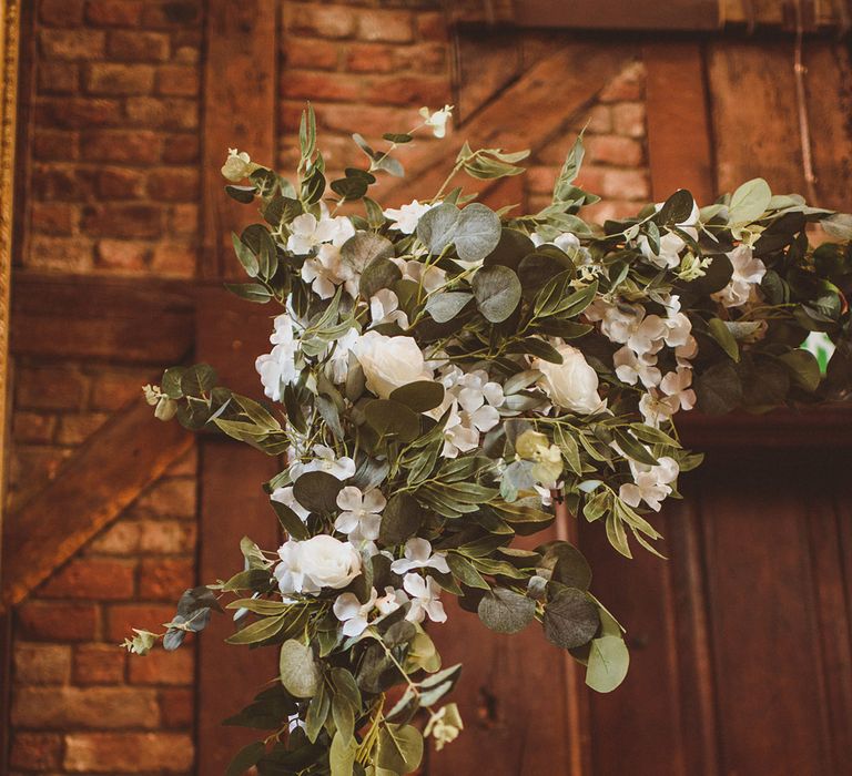 Classic white and green wedding flower decoration for altar display