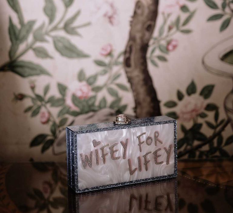 Glitter with pearlised background clutch reading 'wifey for lifey' bridal bag 