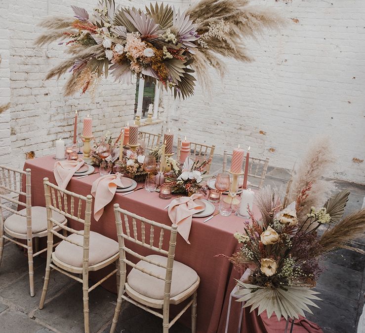 Wedding flower arrangements and table decor with preserved pastel flowers and dried grasses 