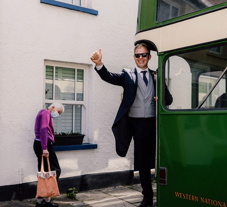 Vintage green bus wedding transportation carrying guests over to the wedding reception 