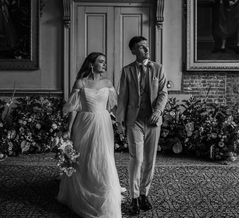 St Giles House in Dorset with the bride and groom posing for their cute couple portraits 