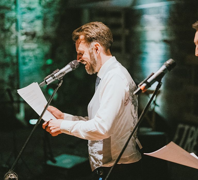 The two best men perform a wedding speech at the reception 