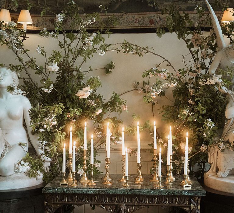 Cosy warm twinkling candlelight with angel cherub statues at Elmore Court 