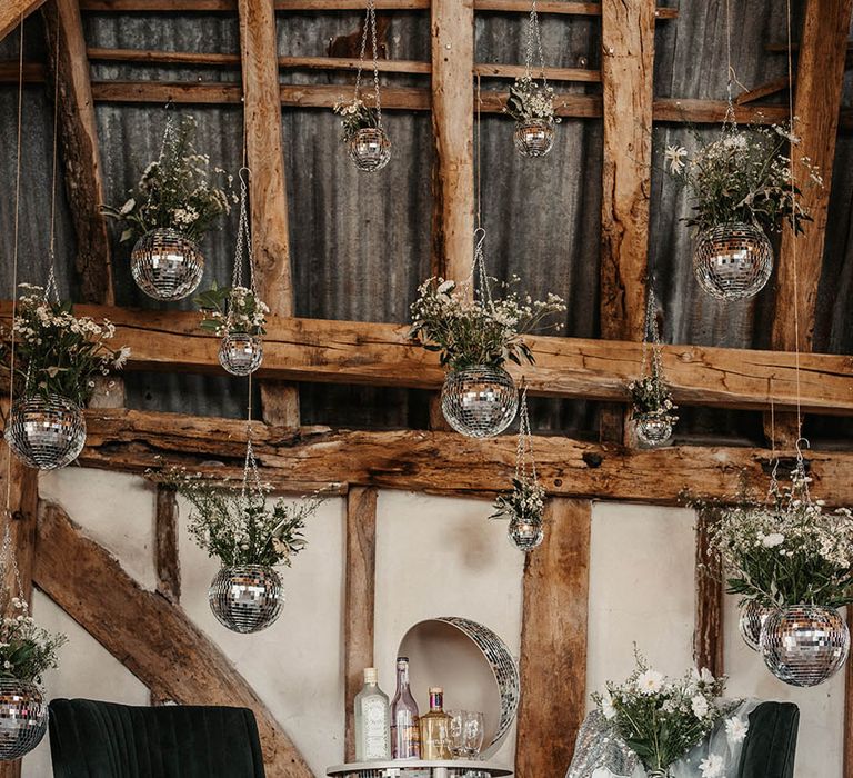 Disco theme wedding with hanging disco ball plant pots and drinks trolley 