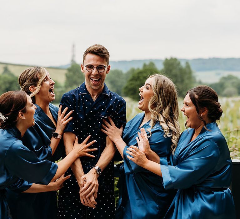 I Do Crew in blue pyjamas and robes getting ready for the wedding 