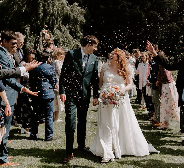 The bride and groom have special confetti moment as they celebrate being married 