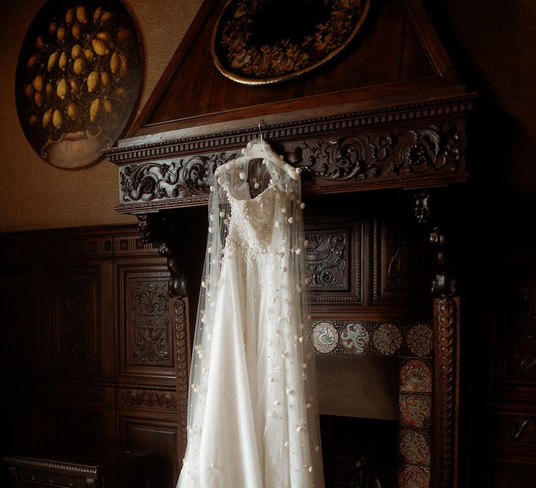 Wedding dress and veil hanging up for the bride 