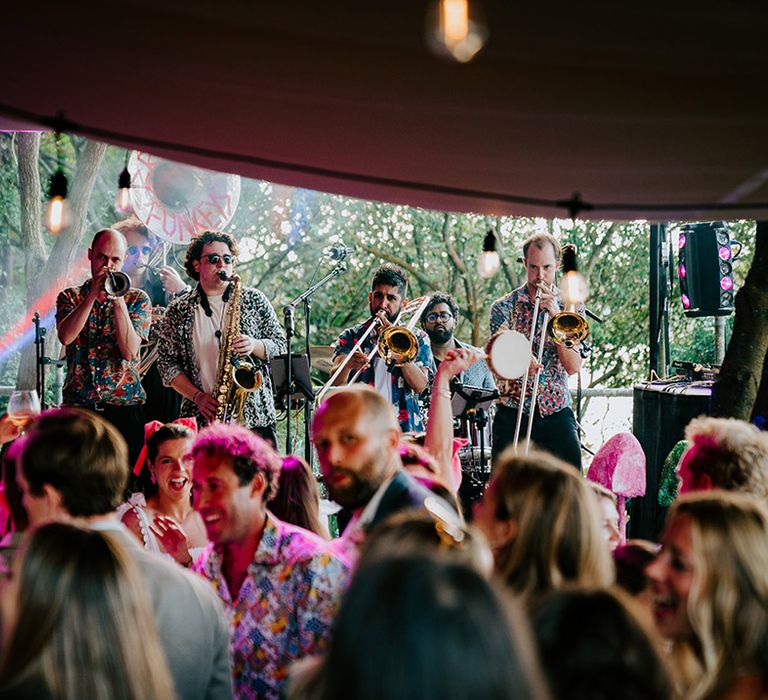 Brass band entertaining guests at the wedding reception 